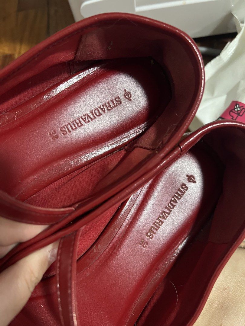 Stradivarius Red Mary Jane Flats Size 38 (Category: Flats & Sandals) located in Paranaque City. Submitted by guevssss (Listing ID 1466207291, Image 2). Description: - Well used but stored properly - Brand: Stradivarius - Style: Glossy Red Mary Jane flats with square toe and buckled strap - Size: EUR 38 - Condition: Light wear on the bottom rubber grip .