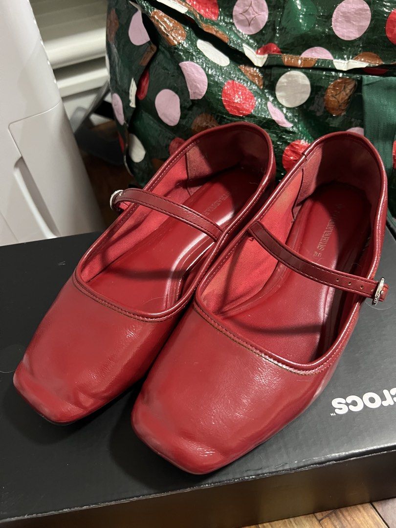 Stradivarius Red Mary Jane Flats Size 38 (Category: Flats & Sandals) located in Paranaque City. Submitted by guevssss (Listing ID 1466207291, Image 1). Description: - Well used but stored properly - Brand: Stradivarius - Style: Glossy Red Mary Jane flats with square toe and buckled strap - Size: EUR 38 - Condition: Light wear on the bottom rubber grip .