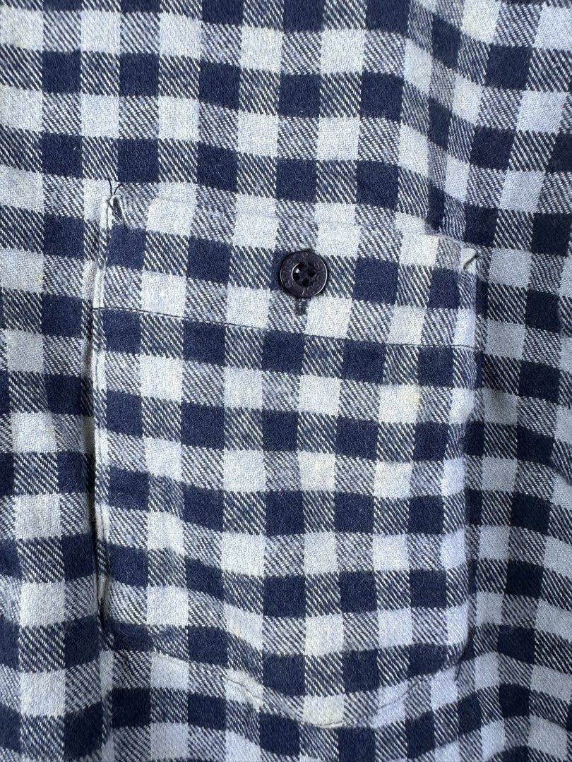 Stüssy Checkered Flannel Shirt Medium (Category: Tshirts & Polo Shirts ) located in Manila. Submitted by declutterpromax (Listing ID 1466214836, Image 2). Description: - Brand: Stüssy - Item: Checkered Flannel Shirt - Color: Black and White with Purple Inner Lining - Size: Medium (Tag attached) - Fit: Regular with long sleeves - Details: Button-down front with branded black buttons, 1 chest pocket - Material: Soft cotton - Condition: Clean, minim