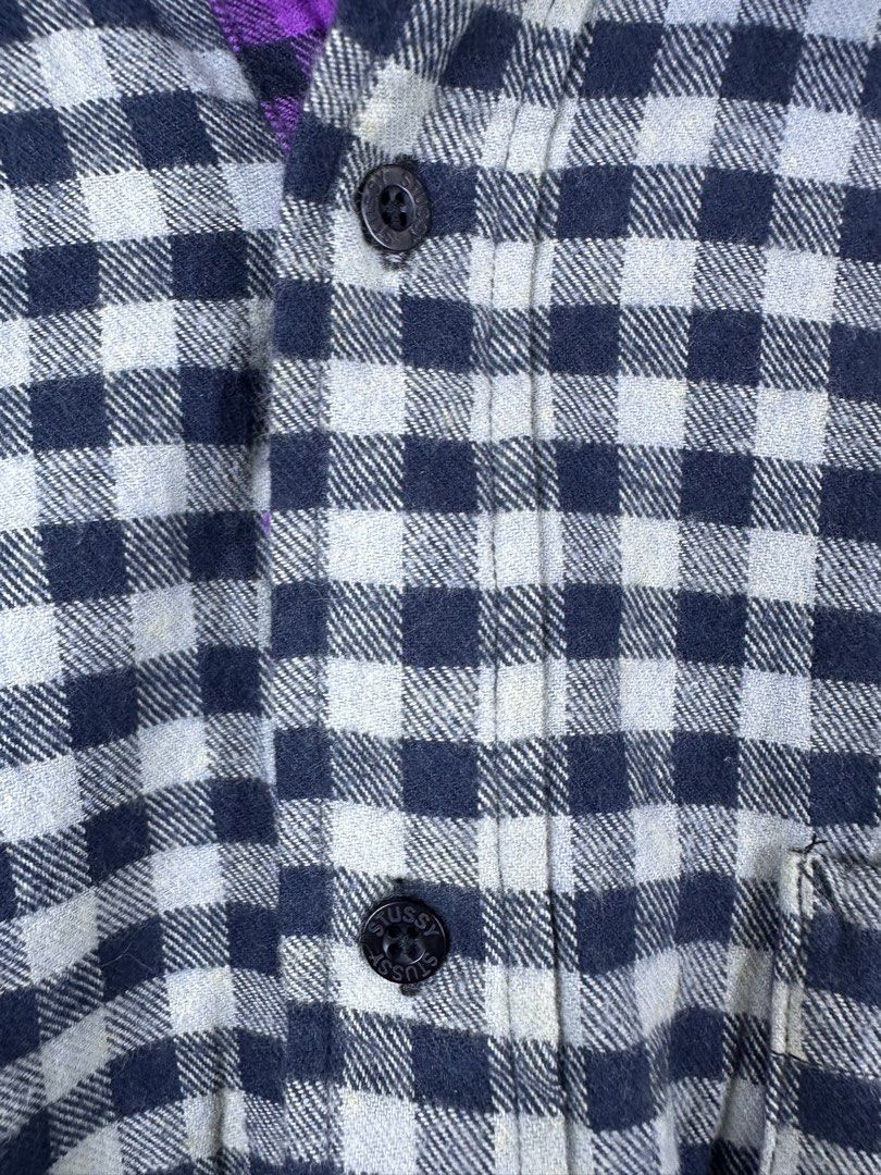 Stüssy Checkered Flannel Shirt Medium (Category: Tshirts & Polo Shirts ) located in Manila. Submitted by declutterpromax (Listing ID 1466214836, Image 3). Description: - Brand: Stüssy - Item: Checkered Flannel Shirt - Color: Black and White with Purple Inner Lining - Size: Medium (Tag attached) - Fit: Regular with long sleeves - Details: Button-down front with branded black buttons, 1 chest pocket - Material: Soft cotton - Condition: Clean, minim