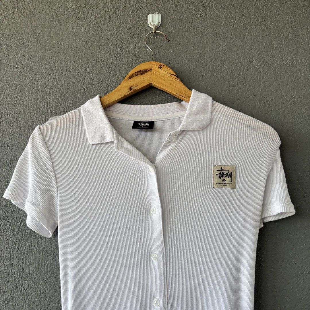 Stussy dresses (Category: Dresses) located in San Fernando. Submitted by diff.thr1ft (Listing ID 1466171059, Image 2). Description: - Brand: Stussy - Type: Ribbed Polo Dress - Color: White - Size: 6 - Material: Cotton - Features: Front button placket, collar, and Stussy logo patch - Condition: Excellent pre-loved condition.