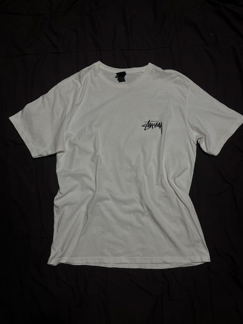 Stussy Kittens Flower Graphic White Tee (Category: Tshirts & Polo Shirts ) located in Davao. Submitted by bothwiseph (Listing ID 1466303582, Image 2). Description: - Brand: Stussy - Color: White - Fit: Comfortable cotton body with tagged collar - Design: Small front chest logo and large kitten with flowers graphic on the back - Style: Classic streetwear piece, perfect for casual wear.