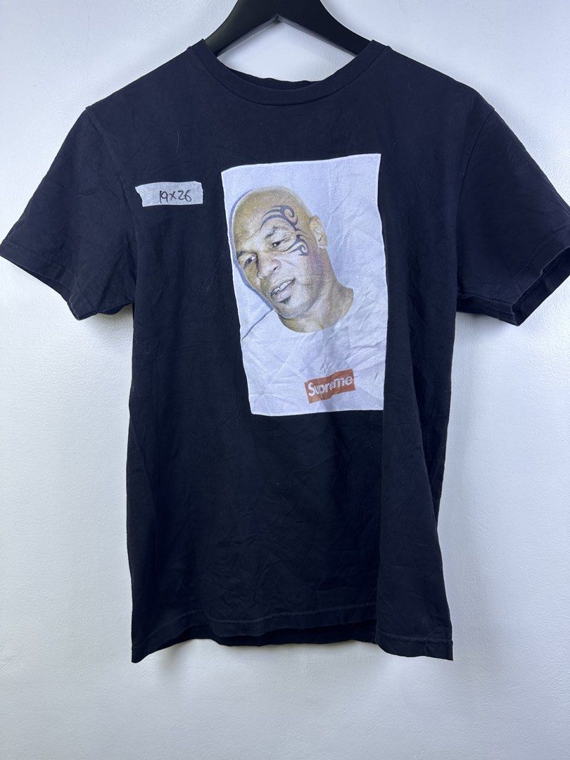 Supreme Mike Tyson Photo Tee Black Medium (Category: Tshirts & Polo Shirts ) located in Manila. Submitted by declutterpromax (Listing ID 1466232117, Image 1). Description: - Brand: Supreme - Design: Mike Tyson graphic photo tee - Color: Classic black - Size: Medium (19" width x 26" length) - Material: 100% pre-shrunk cotton, Made in USA - Condition: Clean neck tag intact - Shipping: Ready to ship.