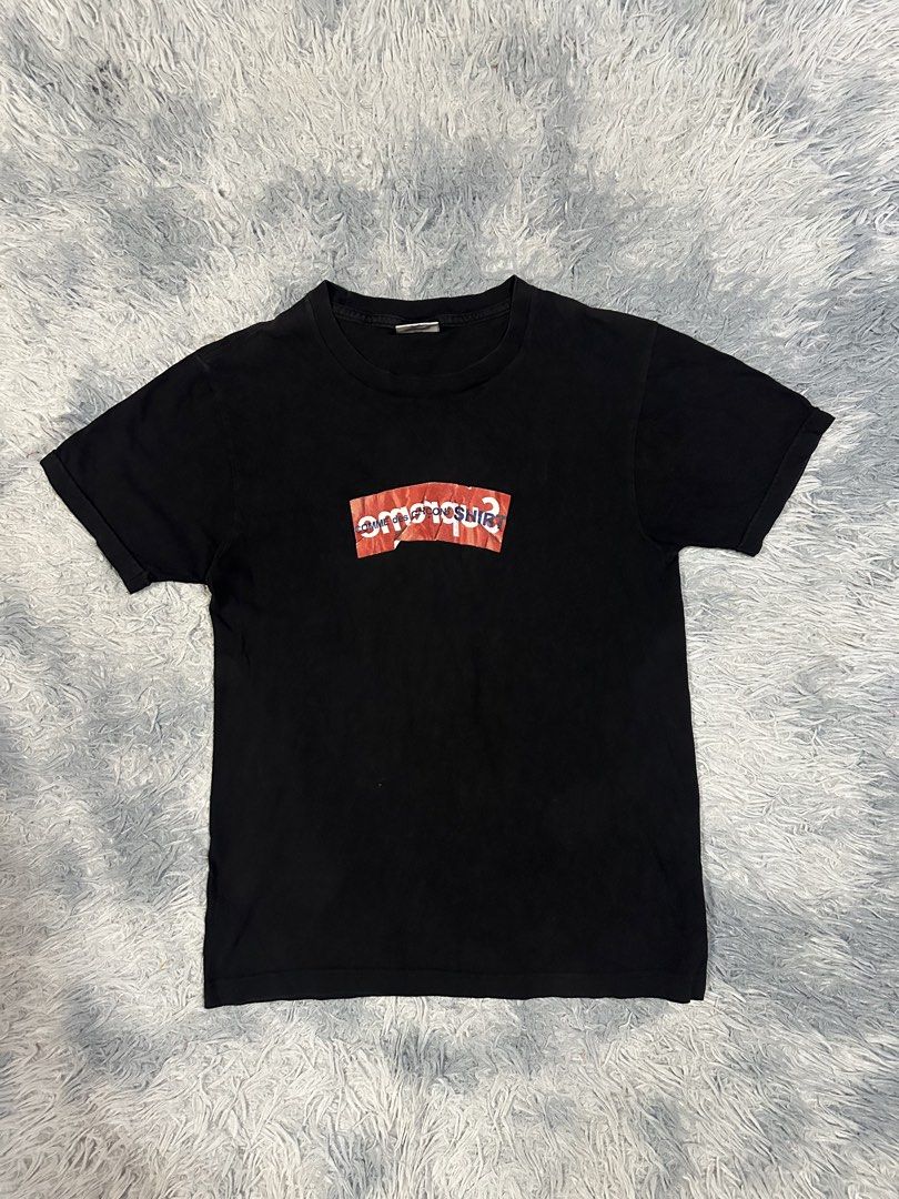 Supreme X Comme Des Garcons Shirt (Category: Tshirts & Polo Shirts ) located in Baao. Submitted by revamped.co (Listing ID 1466250128, Image 1). Description: Supreme X Comme Des Garcons Shirt Verygood Condition Size Small on Tag 18 by 26.5 Color Rate: 9/10 slightly Loose Neckline.
