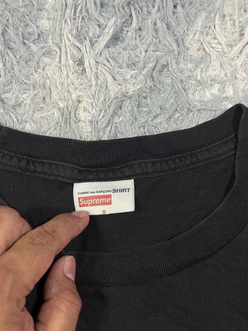 Supreme X Comme Des Garcons Shirt (Category: Tshirts & Polo Shirts ) located in Baao. Submitted by revamped.co (Listing ID 1466250128, Image 2). Description: Supreme X Comme Des Garcons Shirt Verygood Condition Size Small on Tag 18 by 26.5 Color Rate: 9/10 slightly Loose Neckline.