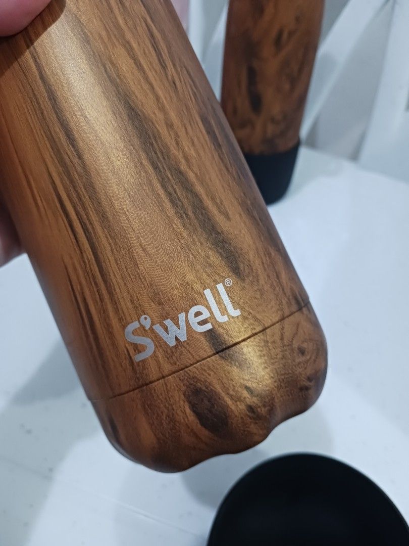 S'well Stainless Steel Water Bottles Bundle Set (Category: Water Bottles & Tumblers) located in Taguig. Submitted by l.a.8 (Listing ID 1466220339, Image 2). Description: - Set of 3 S'well insulated water bottles (Bundle deal) - Capacity: 25oz / 750 ml and 17oz / 500ml - Designs: 1 Pink Marble and 2 Wood Grain finishes - Extras included: Black silicone protective boots and matching black cap carrying loops - Care instructions: Hand wash only - Pri