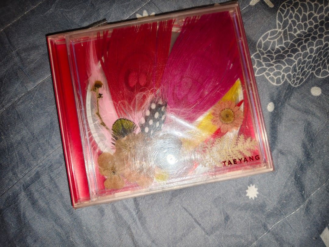 Taeyang 3rd Album White Night CD (Category: CDs & DVDs) located in Manila. Submitted by engrkkkk (Listing ID 1466308317, Image 1). Description: - Album: Taeyang 3rd Mini Album - White Night (Official 2017 release) - Packaging: Red transparent jewel case with pressed flowers and feathers on the cover - Tracklist: Includes Wake Me Up, Darling, Ride, and Empty Road - Authenticity: Comes with Komca holographic sticker on the back - Condition: Light s