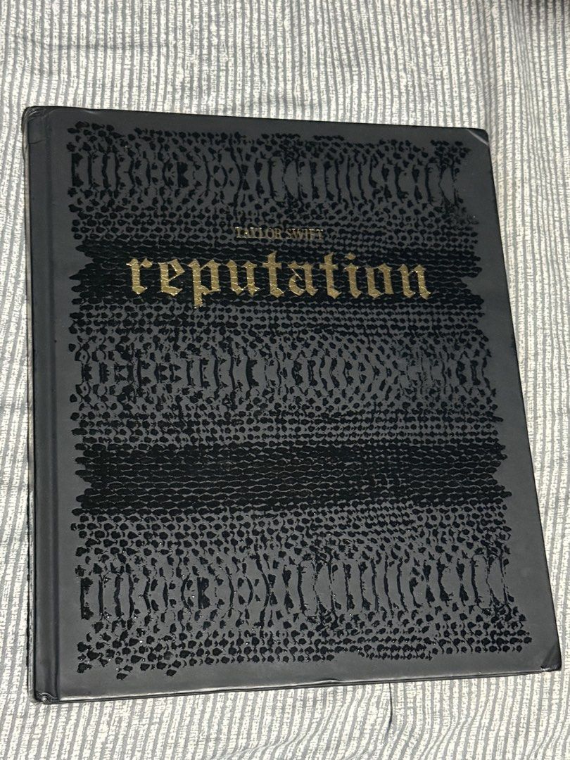 Taylor Swift Reputation Hard bound (Category: Magazines) located in Manila. Submitted by sayelolo18 (Listing ID 1466289902, Image 1). Description: - Official Taylor Swift Reputation - Hardcover photo book with iconic era imagery and poetry - Stunning gold foil lettering on cover and spine - Stylish black snakeskin pattern texture - Clean and intact pages - Dents on sides .