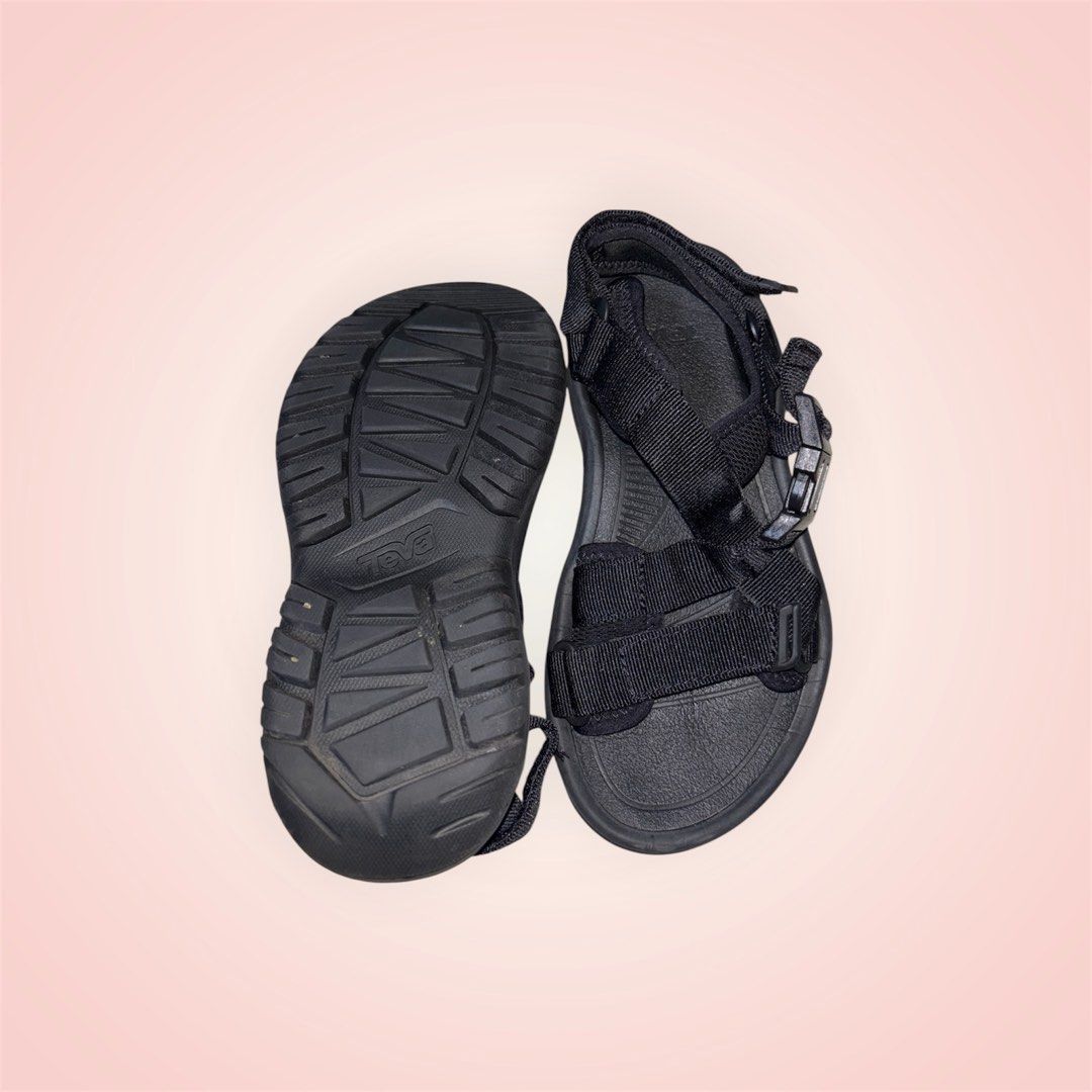 Teva Black Sandals (Category: Flats & Sandals) located in Rosario. Submitted by preloveditems2002 (Listing ID 1466242735, Image 2). Description: - Brand/Model: Black Teva sandals - Fit & Fastening: Adjustable straps and secure buckles for a snug fit - Comfort: Contoured footbed designed for all-day wear - Durability: Tough rubber outsole with a textured grip pattern - Condition: Minimal wear on the treads, excellent for walking, hiking, and casua