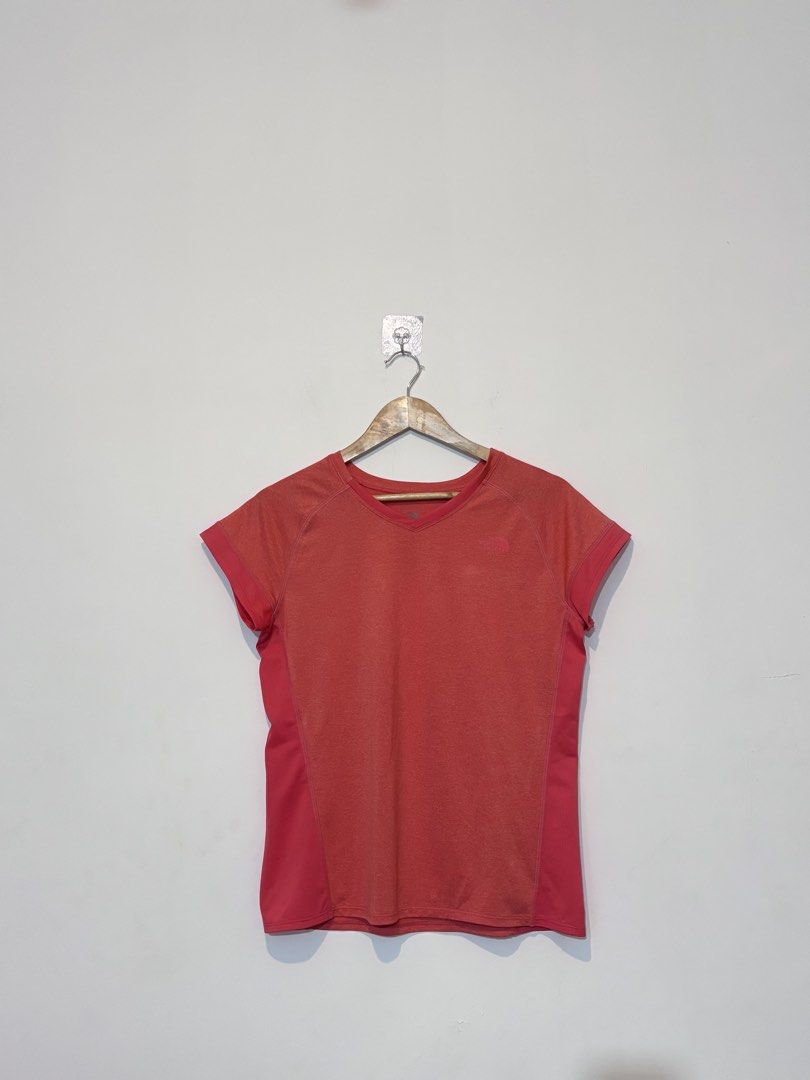 The North Face Drifit Shirt (Category: Shirts) located in Bulacan. Submitted by janeeeeelleeeee (Listing ID 1466188009, Image 1). Description: - Brand: The North Face - Color: Coral pink with contrasting side panels - Size: YL (Youth Large / fits petite adults) - Neckline: V-neck - Material: Lightweight and breathable - Ideal for: Workouts, running, and active wear - Condition: Excellent.