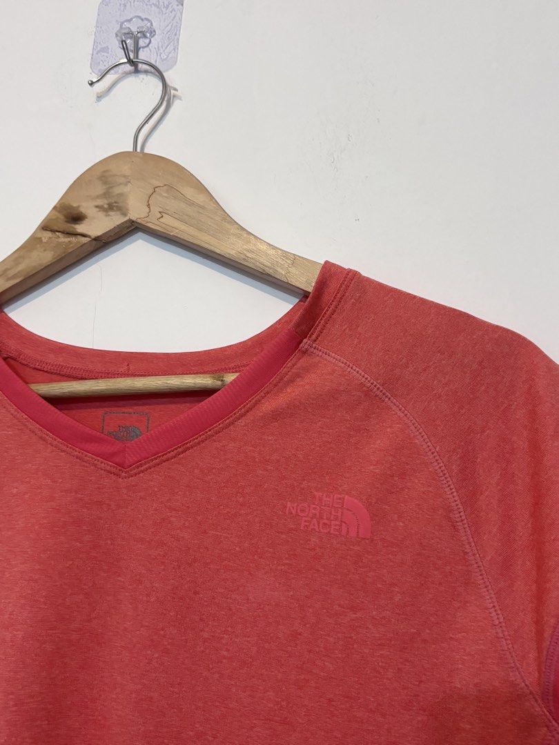 The North Face Drifit Shirt (Category: Shirts) located in Bulacan. Submitted by janeeeeelleeeee (Listing ID 1466188009, Image 2). Description: - Brand: The North Face - Color: Coral pink with contrasting side panels - Size: YL (Youth Large / fits petite adults) - Neckline: V-neck - Material: Lightweight and breathable - Ideal for: Workouts, running, and active wear - Condition: Excellent.