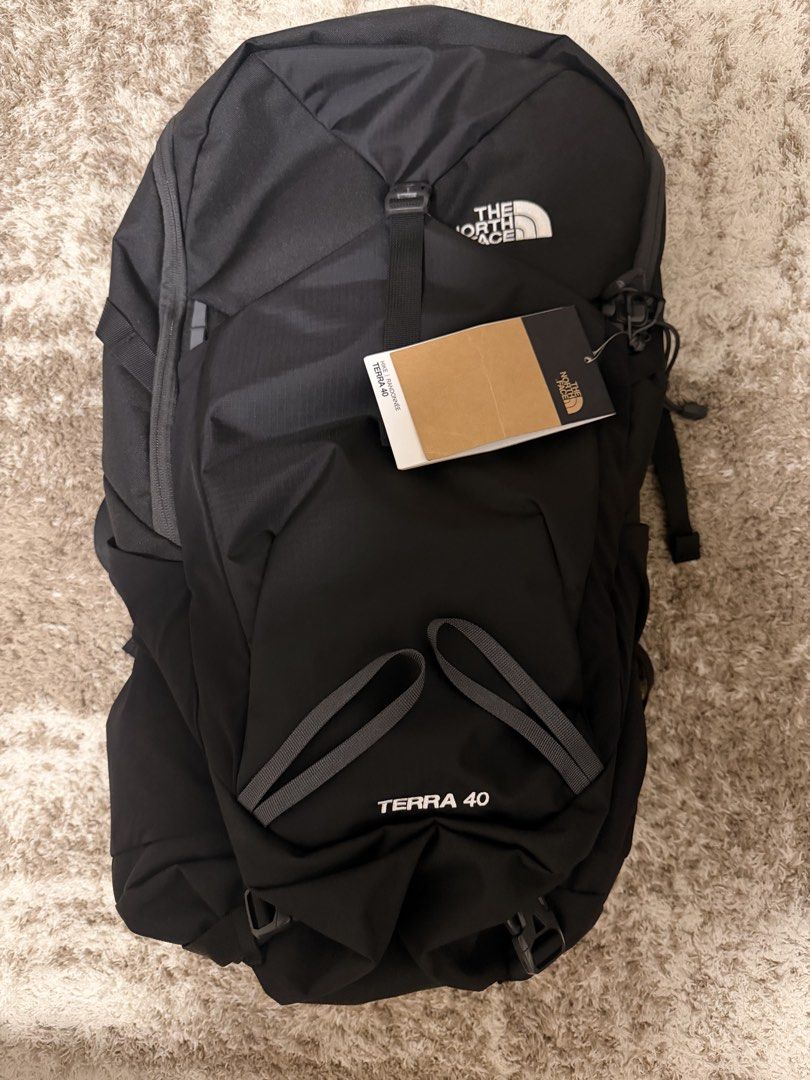 The North Face Terra 40 Backpack Black (Category: Backpacks) located in Makati City. Submitted by ella.mee (Listing ID 1466267337, Image 3). Description: - Brand: The North Face - Model: Terra 40 (Hiking & Outdoors) - Color: Black - Capacity: 40 Liters - Condition: Clean, never used on trails (serial tags still attached) - Features: Durable fabric, multiple adjustment straps, and convenient side pockets.