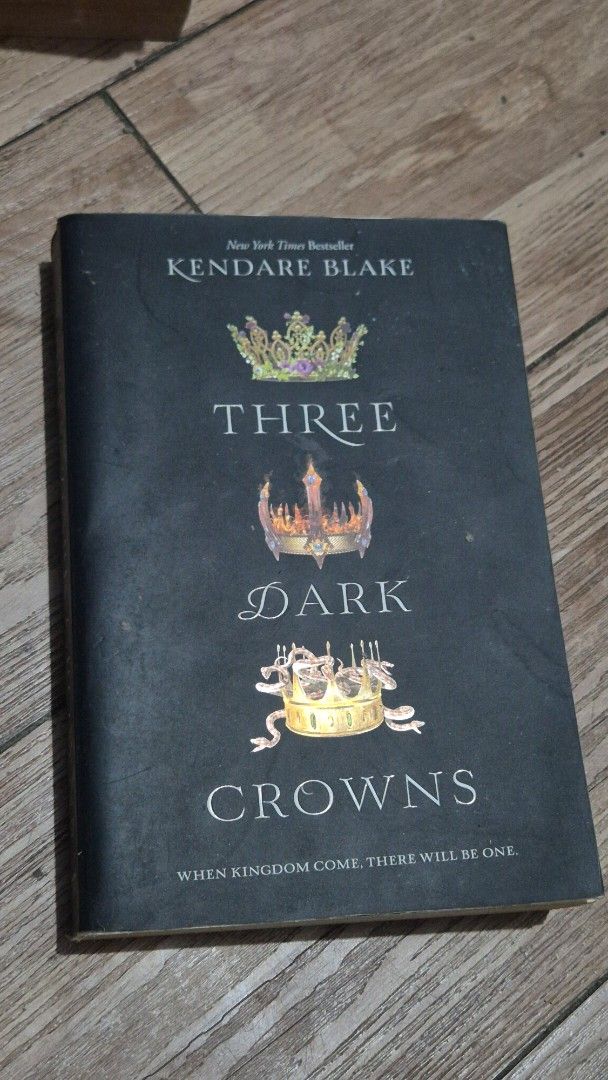 Three Dark Crowns by Kendare Blake (Category: Storybooks) located in Manila. Submitted by abianne (Listing ID 1466304728, Image 1). Description: - Title: Three Dark Crowns by Kendare Blake - Format: Paperback (HarperTeen edition) - Condition: Read thoroughly with yellowed edges due to age and storage - Pages: Intact, clean, and no major rips inside - Ideal as an affordable, reading-copy for fantasy fans!.