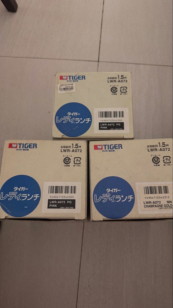 Tiger Lady Lunch Jar LWR-A072 (Category: Food Organization & Storage) located in Pasig City. Submitted by batgirl888 (Listing ID 1466177819, Image 1). Description: - Brand: Tiger - Model: LWR-A072 - Condition: Brand new, unopened in original packaging, super clean finish - Capacity: Holds approx. 1.5 cups of rice - Includes: 3 boxes total (2 pink, 1 champagne gold) - Ideal for: Packing warm meals to work or school.