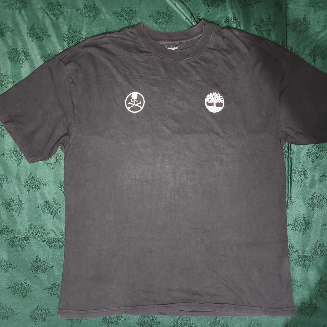Timberland x Mastermind Black T-shirt (Category: Tshirts & Polo Shirts ) located in Antipolo. Submitted by alphaomega_fox (Listing ID 1466254953, Image 2). Description: - Authentic Timberland x Mastermind collaboration t-shirt - size 23x29 - Color: Worn-in vintage black wash - Fit: Regular fit, crew neck - Details: Small dual brand logo on chest - Back Graphic: Large Timberland text with iconic Mastermind skull & crossbones - Material: Comfortabl