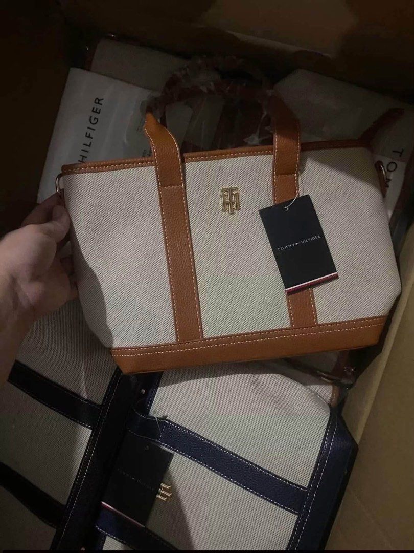 Tommy Hilfiger Canvas Tote Bag (Category: Tote Bags) located in Abucay. Submitted by erindeclutterss (Listing ID 1466203878, Image 3). Description: - nego - authentic - brand new Tommy Hilfiger canvas tote bag - elegant gold-tone TH logo hardware on the front - ideal for daily essentials, work, or casual lakad - comes complete with brand tags as shown.