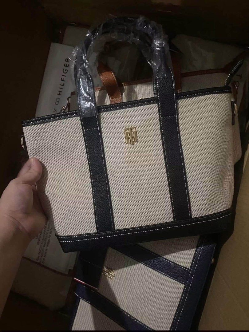 Tommy Hilfiger Canvas Tote Bag (Category: Tote Bags) located in Abucay. Submitted by erindeclutterss (Listing ID 1466203878, Image 2). Description: - nego - authentic - brand new Tommy Hilfiger canvas tote bag - elegant gold-tone TH logo hardware on the front - ideal for daily essentials, work, or casual lakad - comes complete with brand tags as shown.