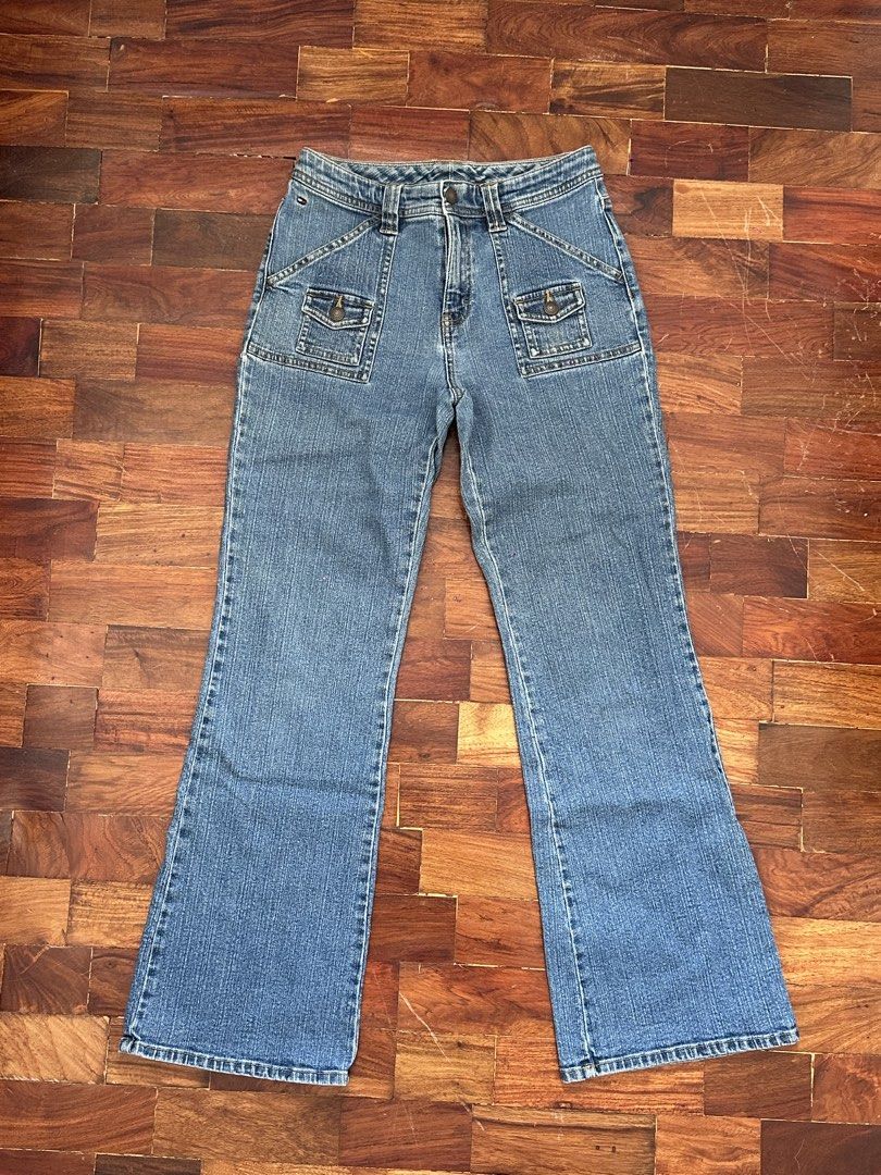 Tommy Hilfiger flare jeans size 14 (Category: Jeans) located in Cainta. Submitted by buy.preloved (Listing ID 1466192659, Image 1). Description: - Brand: Tommy Hilfiger - Style: 90s Y2K flared leg with utility cargo pockets - Color: Medium wash blue - Size: Tagged Size 14 (inside waistband) - Closure: Button and zipper fly - Origin: Made in Bangladesh.