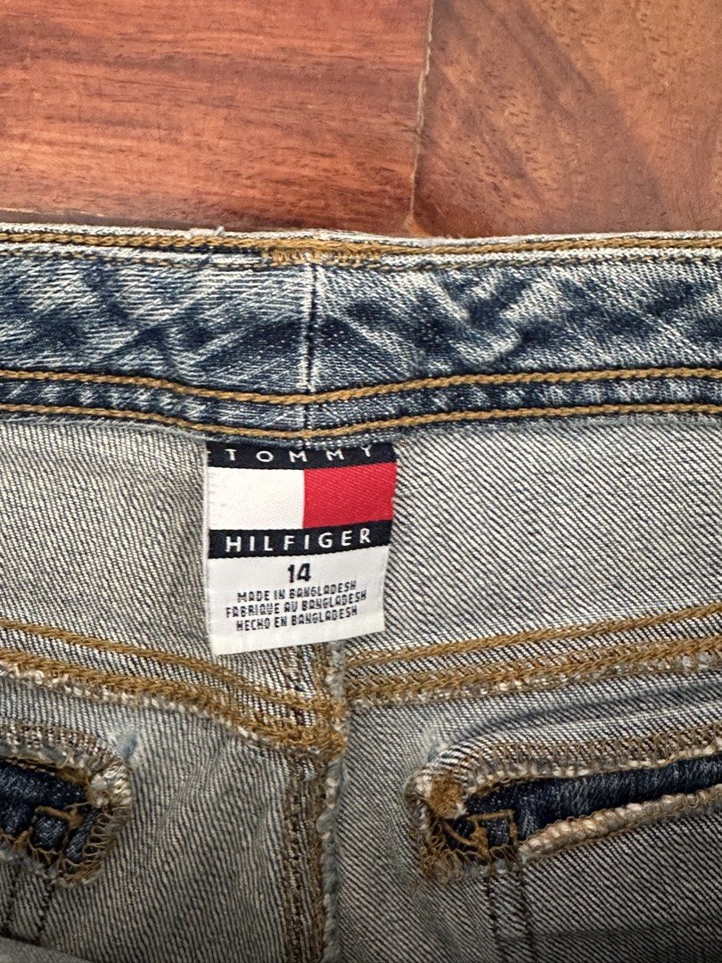 Tommy Hilfiger flare jeans size 14 (Category: Jeans) located in Cainta. Submitted by buy.preloved (Listing ID 1466192659, Image 2). Description: - Brand: Tommy Hilfiger - Style: 90s Y2K flared leg with utility cargo pockets - Color: Medium wash blue - Size: Tagged Size 14 (inside waistband) - Closure: Button and zipper fly - Origin: Made in Bangladesh.