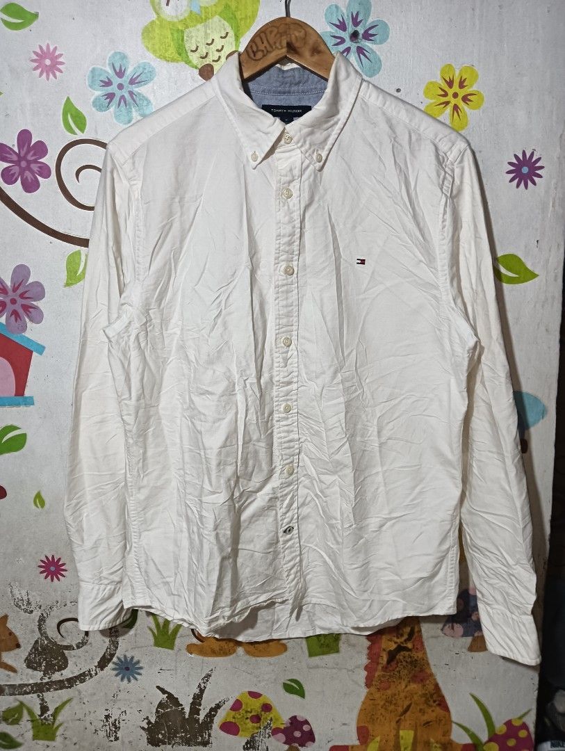 Tommy Hilfiger White Custom Fit Button-Down Shirt (Category: Tshirts & Polo Shirts ) located in Taguig. Submitted by dandanathriftshop (Listing ID 1466270095, Image 1). Description: FORSALE ‼️ TOMMY OXFORD WHITE EXCELLENT CONDITION NO ISSUE MEDUIM ON TAG 21.5 WIDTH 28 LENGTH 799 FREESHIPPING DM 📥.