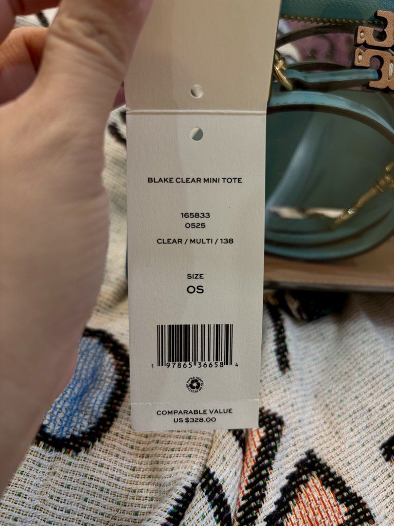 Preloved Tory Burch Blake Clear Mini Tote Bag (Category: Luxury Bags & Wallets) located in Naguilian. Submitted by MyJanuary (Listing ID 1466163744, Image 2). Description: - Preloved Tory Burch Blake Clear Mini Tote - 💯original - Colorway: Multi (Transparent PVC body, tan leather base, and contrast yellow top handles) - Hardware: Gold-tone - Strap: Detachable light blue leather crossbody strap - Condition: excellent condition - with its original