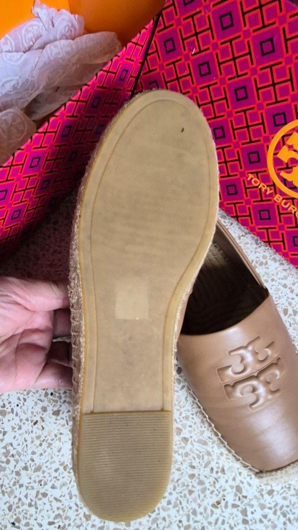 Tory Burch Leather Espadrilles Flat Shoes Tan Brown (Category: Flats & Sandals) located in Davao. Submitted by mommylove1422 (Listing ID 1466229321, Image 3). Description: - Authentic Tory Burch tan leather espadrilles - Features a stylish big embossed logo on top - Classic jute wrap around the midsole - Comfortable slip-on design with a flat rubber outsole - Condition: Clean overall with minimal wear on the soles - Includes original patterned bo