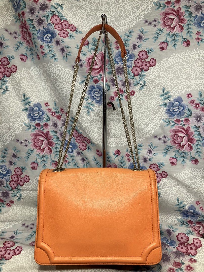TOUS ORANGE FOLDOVER FLAP SHOULDER BAG (Category: Shoulder Bags) located in General Mariano Alvarez. Submitted by adonid (Listing ID 1466203702, Image 3). Description: TOUS ORANGE FOLDOVER FLAP SHOULDER BAG GOOD CONDITION NORMAL SIGN OF USAGE ONLY.