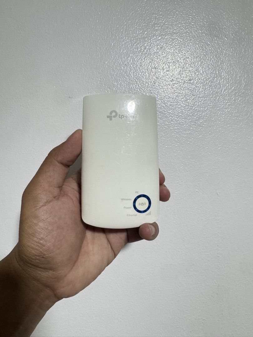 TP-Link Wi-Fi Range Extender (Category: Networking) located in Taguig. Submitted by jhnlndllcndn (Listing ID 1464682062, Image 1). Description: - TP-Link Wi-Fi Range Extender - Boosts and extends your Wi-Fi signal - Plugs directly into a wall socket for convenience - Features an Ethernet port for wired connections - Shows minor scuffs and dust from previous use, but functions perfectly.