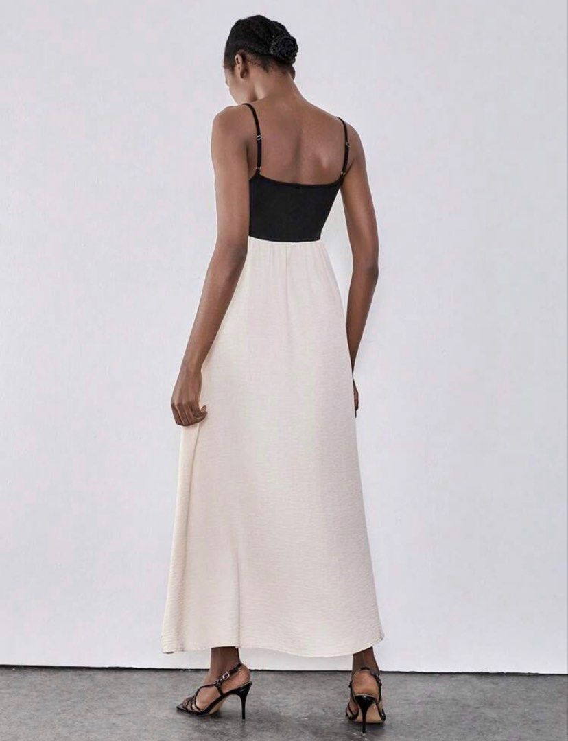 Two-tone Spaghetti Strap Maxi Dress Black Cream (Category: Dresses) located in Pasig City. Submitted by kutleyn (Listing ID 1466263663, Image 2). Description: - Color: Black bodice with a cream maxi skirt - Design: Spaghetti straps, fitted top, and flowy bottom - Versatility: Clean look, perfect for styling for various occasions - Condition: Brand new and ready to wear.