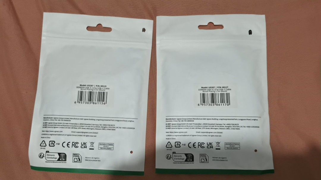 UGREEN USB-A to USB-C Cable 0.5m & 1.5m (Category: Cables & Adaptors) located in Manila. Submitted by cheolbinsart (Listing ID 1466300393, Image 2). Description: - Brand: UGREEN - Type: USB-A 2.0 to USB-C charging cables - Color: Black with nickel plating - Bundle includes: - 1x 0.5-meter cable (Model: US287, PN: 60115) - 1.5-meter cable (Model: US287, PN: 60117) - Condition: Brand new, factory-sealed in original packaging with barcodes (NEVER US