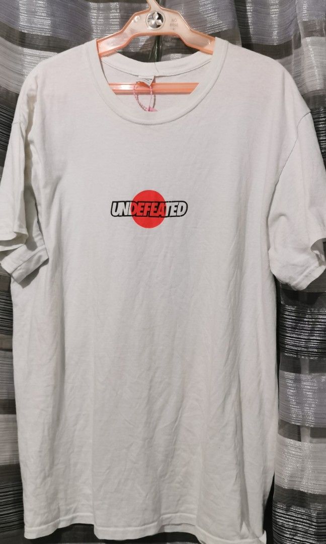 Undefeated white graphic tee (Category: Tshirts & Polo Shirts ) located in San Jose. Submitted by thrift_ni_sir (Listing ID 1466162630, Image 1). Description: Large on tag MOP gcash MOD j&t Add shipping fee.