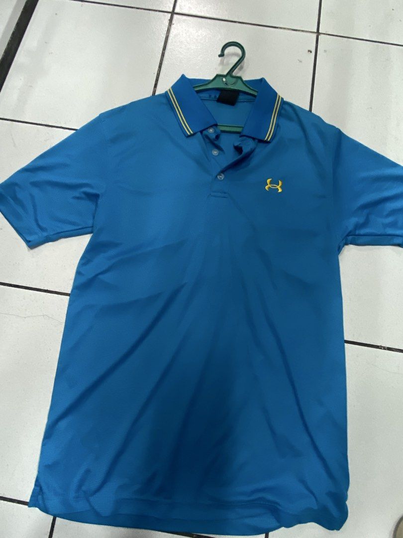 Under Armour Blue Polo Shirt Size M (Category: Tshirts & Polo Shirts ) located in Manila. Submitted by ariane0422 (Listing ID 1466257953, Image 1). Description: - Brand: Under Armour - Size: Men's Medium - Color: Bright blue with contrast yellow collar and logo details - Material: Breathable athletic fabric - Design: Short sleeve, button-front polo - Condition: Clean, excellent overall condition.