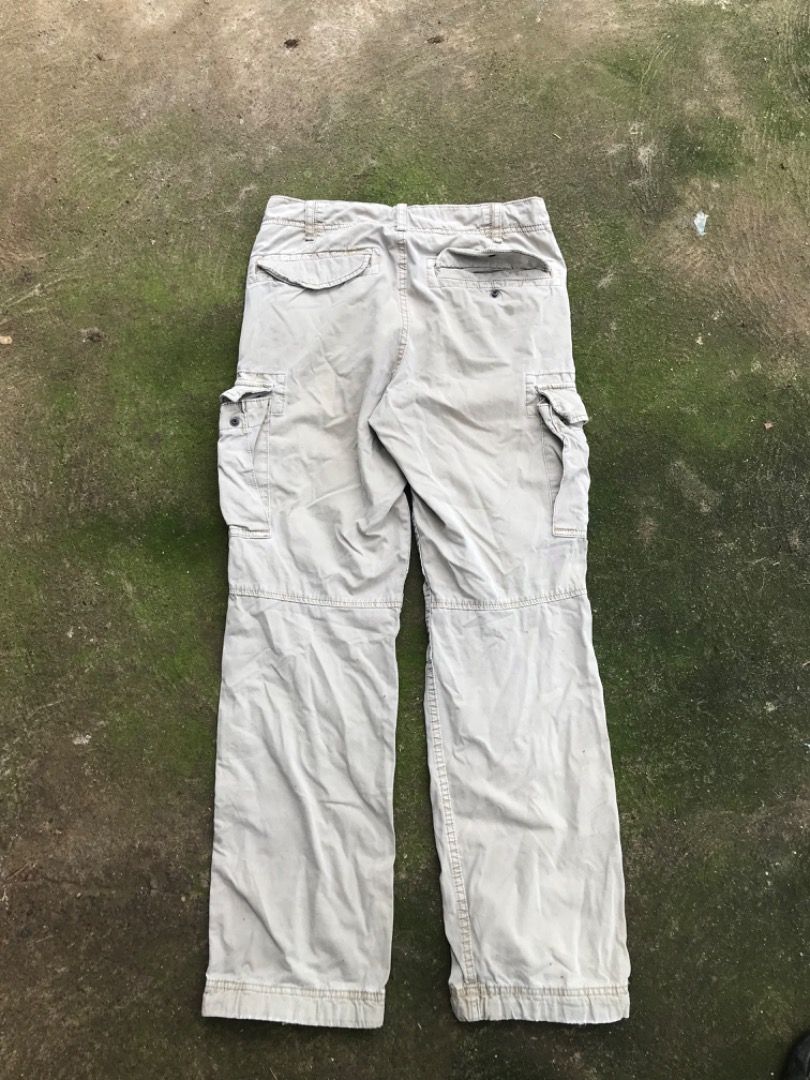 Uniqlo Beige Cargo Pants Size S (Category: Trousers) located in Jimenez. Submitted by onlythrifty_ (Listing ID 1466212619, Image 1). Description: - Brand/Model: Uniqlo Cargo Pants - Color: Classic Beige - Material: Comfortable cotton fabric - Size: S (JP 165/72A) - Fit: Relaxed fit for everyday wear - Pockets: Multiple utility pockets on sides and back - Waist: 30 can fit to 32 - Cuffs: Drawstring ties to adjust leg openings.