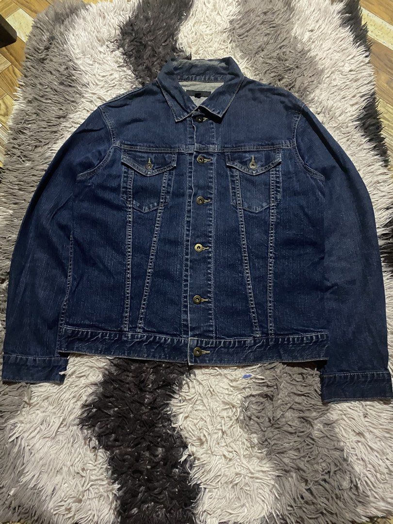Uniqlo Dark Blue Denim Jacket fit medium (Category: Coats, Jackets and Outerwear) located in Manila. Submitted by coollion.19b40f (Listing ID 1466279396, Image 1). Description: - Brand: Uniqlo - Color: Dark blue - Size: XL - Material: Sturdy denim - Features: Classic button-up front, chest pockets, and contrast stitching - Condition: Great, no major flaws - Origin: Made in China - Style: Versatile outerwear, perfect for layering.