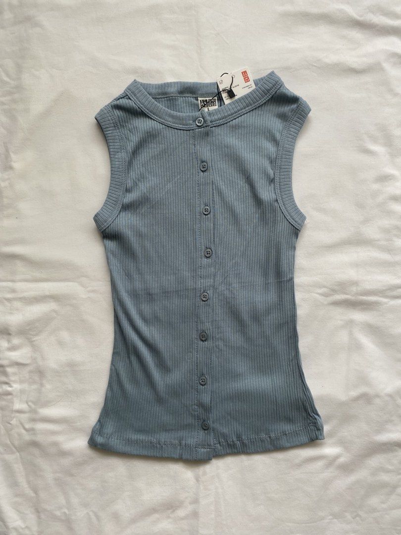 Uniqlo Ribbed Button Front Tank Top Blue Size L (Category: Sleeveless) located in Valenzuela. Submitted by mandies_25 (Listing ID 1466277290, Image 1). Description: - Brand: Uniqlo - Condition: Brand new with original store tags attached - Size: XS - Color: Light blue with matching grey buttons - Material: Soft, stretchy cotton fabric - Design: Scoop neckline, sleeveless, and button-down front closure - Style: Simple basic piece, perfect for ever