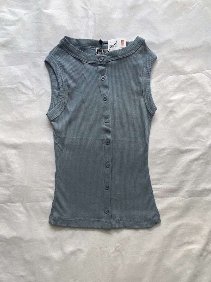 Uniqlo Ribbed Button Front Tank Top Blue Gray (Category: Sleeveless) located in Valenzuela. Submitted by mandies_25 (Listing ID 1466279607, Image 1). Description: - Brand: Uniqlo - Color: Blue gray - Condition: Brand new with original paper tags attached - Design: Sleeveless with a classic crew neckline - Details: Full front button placket with matching round buttons and a flattering ribbed texture throughout - Size:XS.