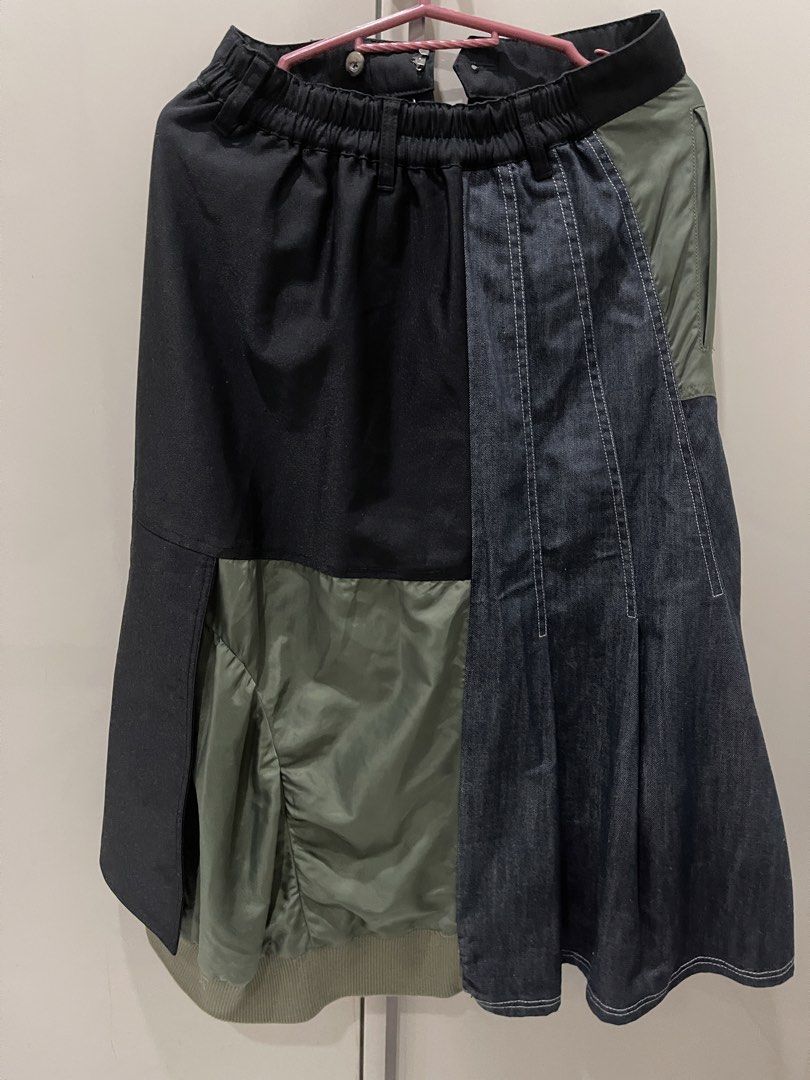 Unique Multi-Panel Patchwork Skirt Denim Olive Black (Category: Skirts) located in Manila. Submitted by mariel1124 (Listing ID 1466245494, Image 2). Description: - Unique asymmetrical patchwork design mixing black fabric, olive green nylon, and dark denim - High elastic waist with belt loops for a comfortable and adjustable fit - Features pleated denim, utility pocket detailing, and stylish double-breasted front buttons - Finished with a trendy r