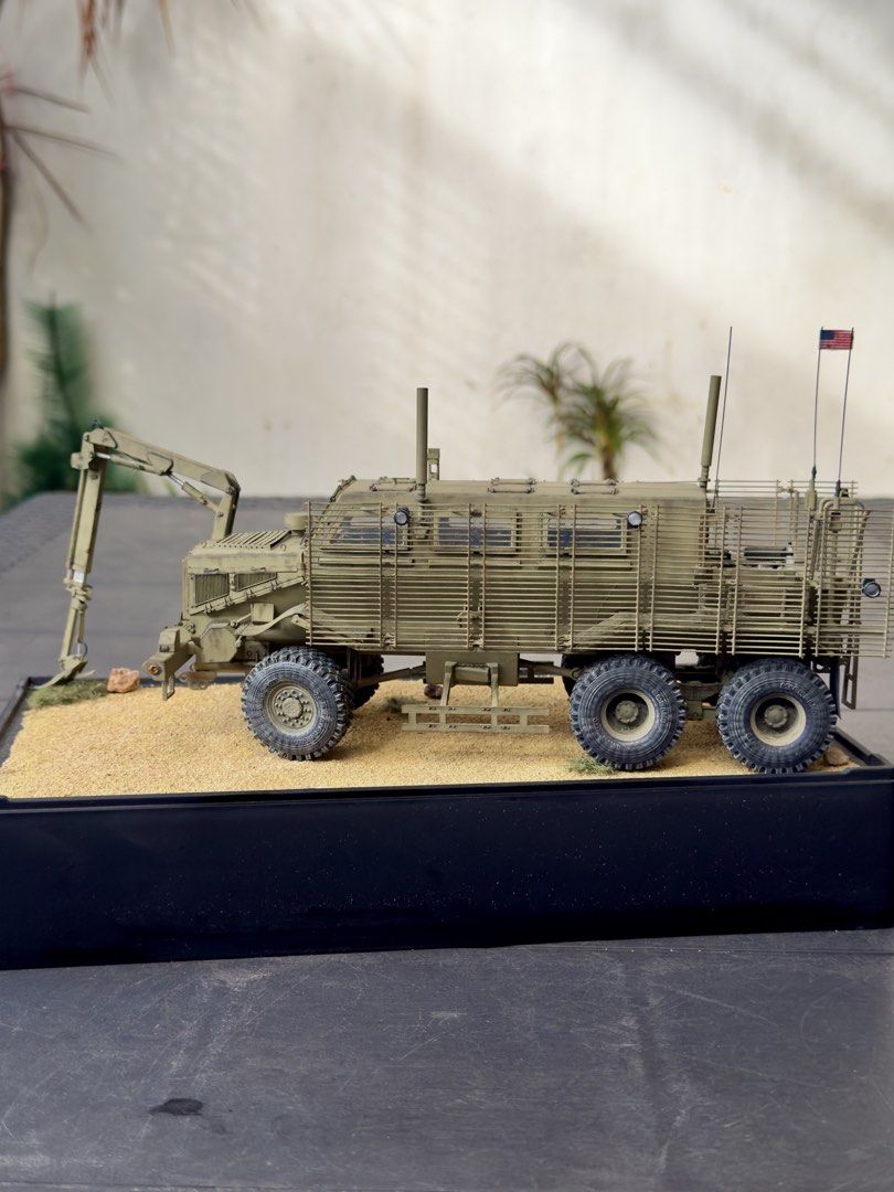US Army Mine Resistant Ambush Protected Vehicle Model (Category: Vehicle & Diecast Models) located in Quezon City. Submitted by fazerecovery83 (Listing ID 1466233115, Image 3). Description: - Custom weathered US Army MRAP scale model in desert tan - Features realistic slat armor, crane attachment, and detailed desert diorama base - Fully loaded with accessories including M4 carbine, ammo boxes, and water bottles - Expertly applied weathering effe
