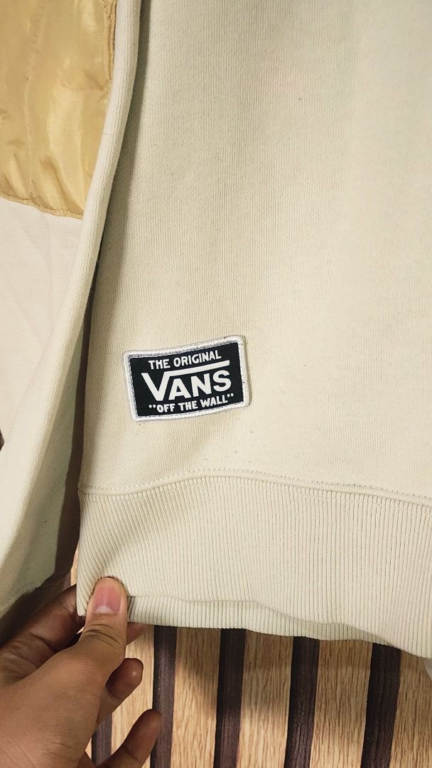Vans Off The Wall Cream Sweatshirt Medium (Category: Coats, Jackets and Outerwear) located in Baguio. Submitted by genesisomega (Listing ID 1466278384, Image 2). Description: - Brand: Vans - Style: Crewneck sweatshirt with chest zipper pocket and contrasting elbow patches - Color: Cream - Size: Medium - Material: 70% cotton, 30% polyester (Made in China) - Details: Woven patch logo on lower hem .