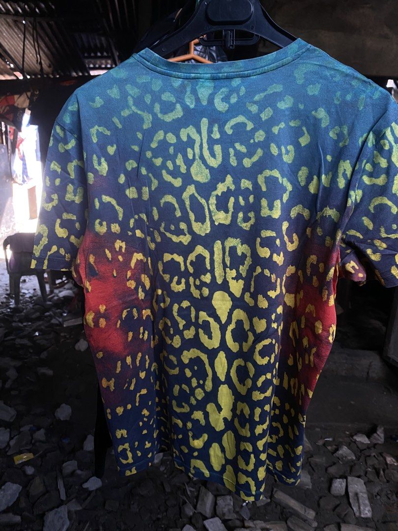 Versace Leopard Print Graphic T-Shirt Size M (Category: Tshirts & Polo Shirts ) located in San Fernando. Submitted by thrifteezy6 (Listing ID 1466203825, Image 3). Description: - Brand: Versace - Design: Bold multicolor leopard animal print (blue, green, yellow, red) - Size: Medium (regular fit) - Details: Crew neck, short sleeves, Made in Italy label - Mode of Payment: GCash or BDO accepted - Shipping: Fast shipping via J&T Express or LBC.