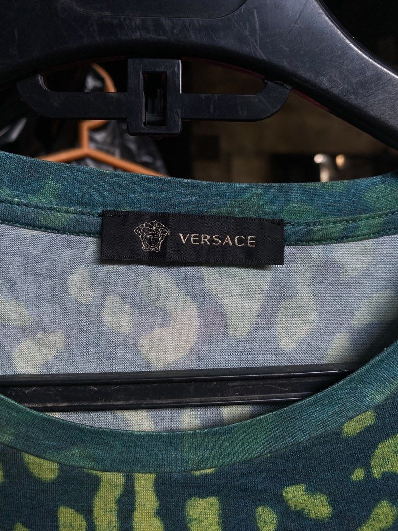 Versace Leopard Print Graphic T-Shirt Size M (Category: Tshirts & Polo Shirts ) located in San Fernando. Submitted by thrifteezy6 (Listing ID 1466203825, Image 2). Description: - Brand: Versace - Design: Bold multicolor leopard animal print (blue, green, yellow, red) - Size: Medium (regular fit) - Details: Crew neck, short sleeves, Made in Italy label - Mode of Payment: GCash or BDO accepted - Shipping: Fast shipping via J&T Express or LBC.
