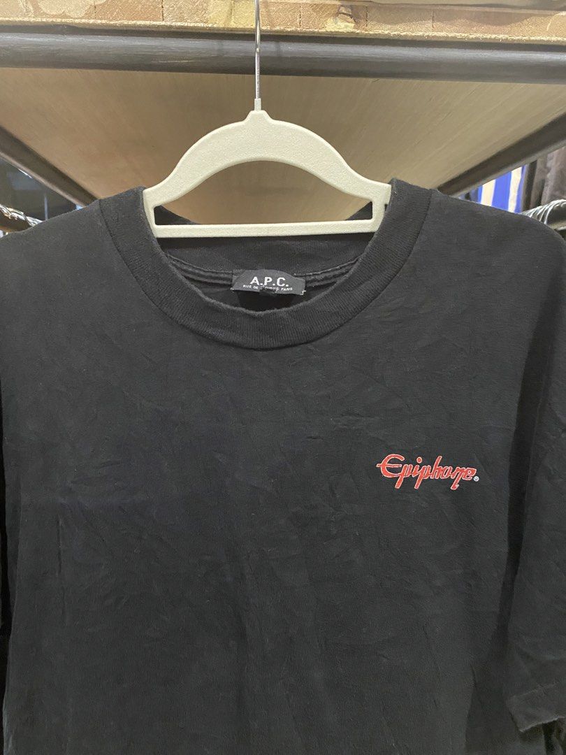 Vintage APC x Epiphone 1999 collobaration Shirt (Category: Tshirts & Polo Shirts ) located in Manila. Submitted by jmonthriftfinds. (Listing ID 1466296283, Image 3). Description: This is a vintage A.P.C. x Epiphone 1999 collaboration T-shirt featuring a red Epiphone-style “E” logo on the back with the text “The Mark of a Great Guitarist!”. Size 2 Fit medium 21x26 Dimes Good condition 9/10 color rate Issue - minimal hairline sa print halos d halat