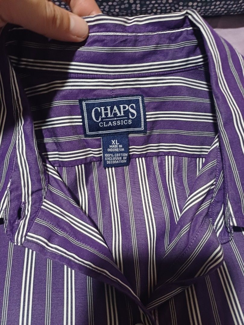 Vintage Chaps by Ralph Lauren Classics Purple Striped Button-Down Shirt (Category: Others Tops) located in San Juan City. Submitted by marie_d_r (Listing ID 1466251204, Image 3). Description: - Brand/Model: Chaps Classics button-down shirt - Color/Pattern: Purple with white vertical stripes - Size: XL - Material: 100% cotton (Made in Indonesia) - Features: Long sleeves with button cuffs, classic collar, single chest pocket, and branded buttons - 