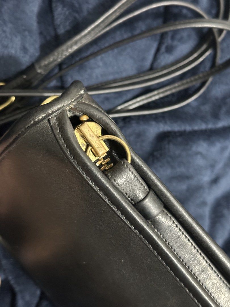 Vintage Coach Basic Bag (Category: Cross-body Bags) located in Baguio. Submitted by renzer.thomas (Listing ID 1466268370, Image 2). Description: - Authentic vintage Coach bag made in the USA - Crafted from premium black glove-tanned cowhide leather - Elegant gold-tone brass hardware and matching hangtag included - Secure zipper closure with a clean inner compartment and slip pocket - Dual carrying options: long adjustable strap and detachable wri