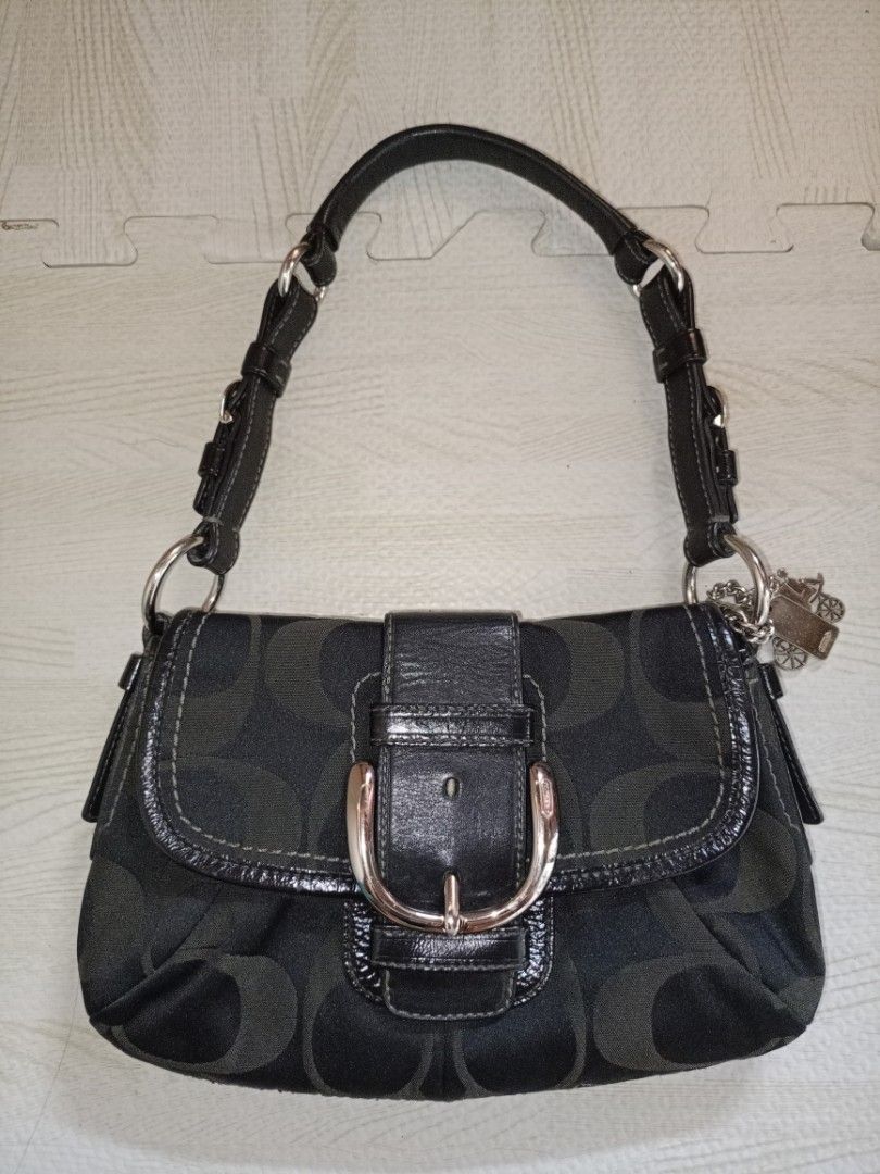 Vintage Coach Soho Rank SA (Category: Luxury Bags & Wallets) located in Quezon City. Submitted by elle_f08 (Listing ID 1466234920, Image 1). Description: - Brand: Coach - Material: Signature monogram jacquard fabric with smooth black leather trim - Color: Black and grey tones with silver-tone hardware - Closure: Front buckle closure - Strap: Adjustable leather shoulder strap with buckle detail - Inclusions: Original metal Coach carriage hangtag o