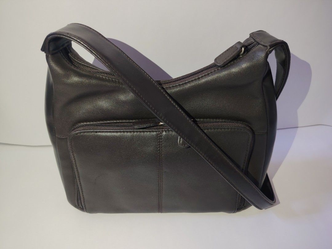 Vintage Dark Brown Leather Multi-Pocket Shoulder Bag (Category: Shoulder Bags) located in Tarlac. Submitted by your_finds (Listing ID 1466247471, Image 3). Description: Description: Sample Not sure kung genuine ang leather, but it looks like it, if not it is a high-quality leather. Condition: 8/10 / Good condition Issue: - May mga maliliit na part na medyo nag-fade na ang color, pero na repaint na kaya hindi na ito halata - Nag-fade ng kaunti ang