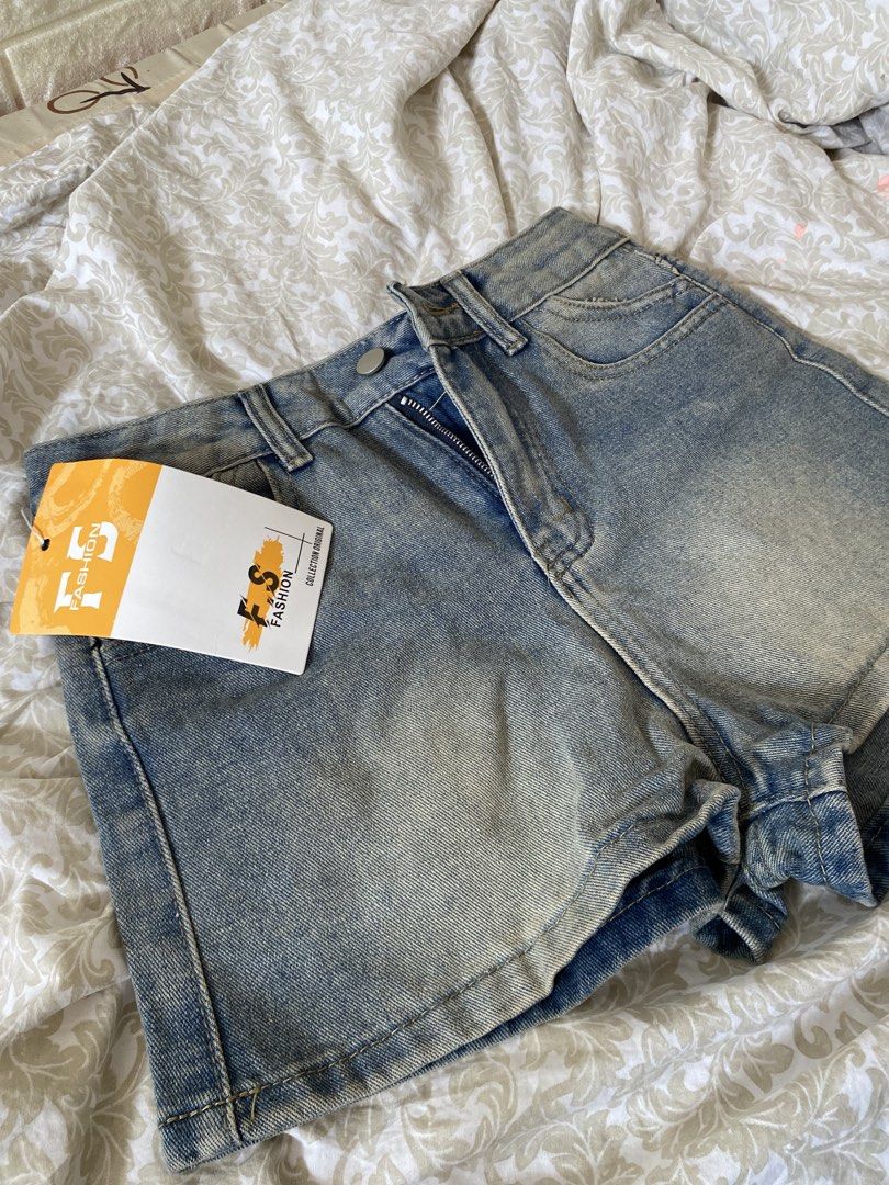 Vintage Denim Shorts (Category: Shorts) located in Rizal. Submitted by mochimchim29 (Listing ID 1466301921, Image 1). Description: - Brand: FS Fashion - Style: High-waisted denim shorts - Color: Light wash blue - Condition: Brand new with original tags attached - Features: Front zipper closure, belt loops, and back pockets.
