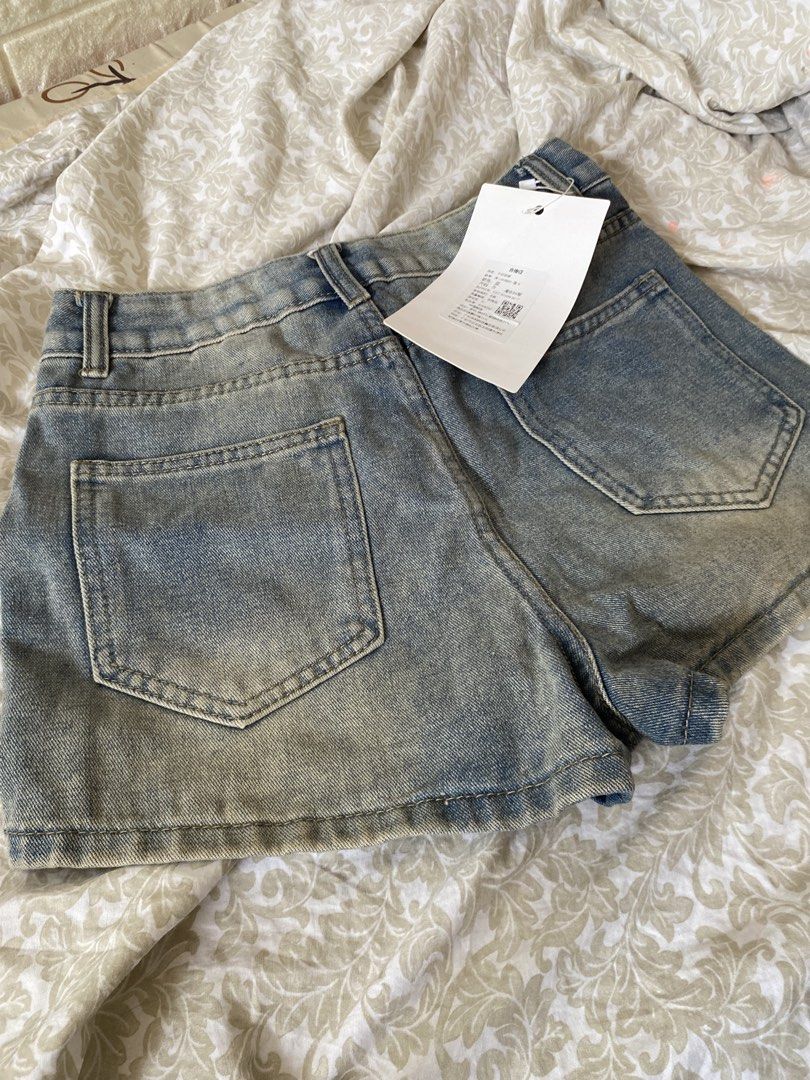 Vintage Denim Shorts (Category: Shorts) located in Rizal. Submitted by mochimchim29 (Listing ID 1466301921, Image 2). Description: - Brand: FS Fashion - Style: High-waisted denim shorts - Color: Light wash blue - Condition: Brand new with original tags attached - Features: Front zipper closure, belt loops, and back pockets.