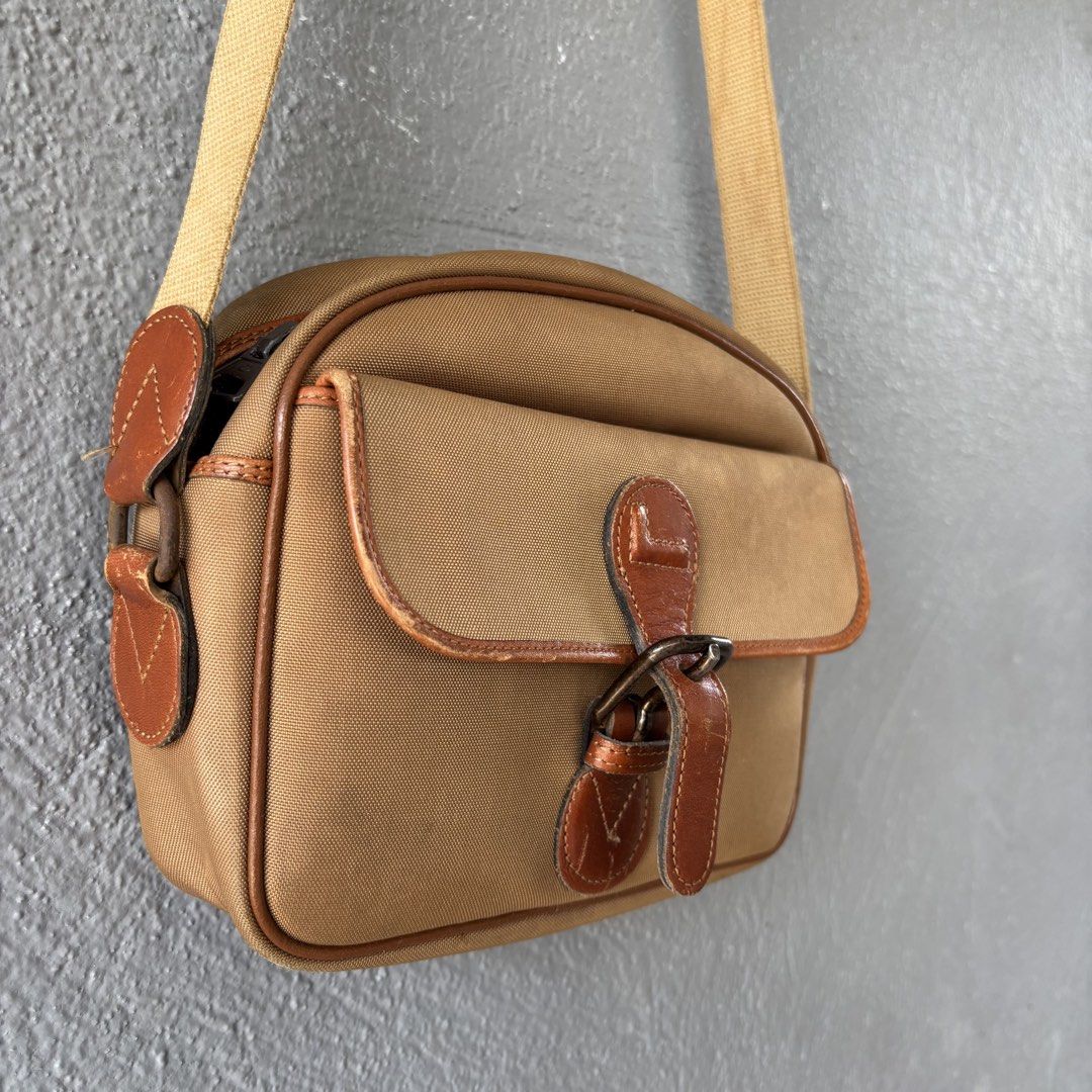 Vintage lancel paris bag (Category: Sling Bags) located in San Fernando. Submitted by diff.thr1ft (Listing ID 1466169198, Image 3). Description: - Authentic vintage Lancel Paris sling bag - Classic tan/beige canvas body with brown leather trim - Front flap pocket with secure buckle closure - Convenient zippered main compartment and back zip pocket - Durable, adjustable canvas shoulder strap - Timeless design perfect for everyday casual wear Issue