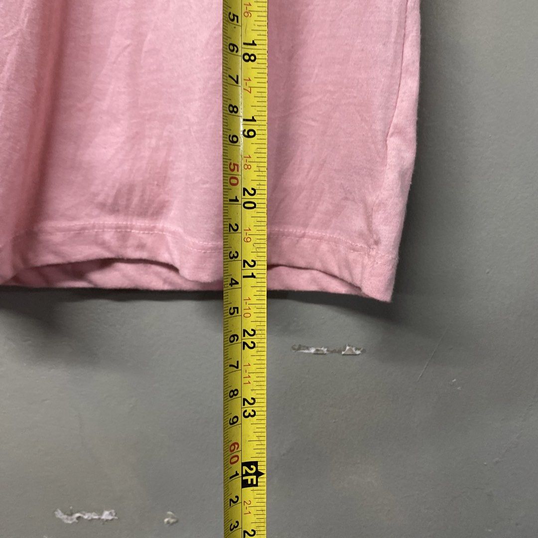 Von Dutch Pin-Up Wanted Graphic Tee Pink Medium (Category: Shirts) located in Cagayan de Oro. Submitted by sumamestreethub (Listing ID 1466247201, Image 2). Description: - Brand: Von Dutch Originals - Color: Light Pink - Size: Medium (true to size, slim fit) - Design: Vintage pin-up girl graphic with 'Wanted in 50 States' text - Details: Short sleeves, crew neck - Condition: Clean fabric, no stains, and print has no fading.